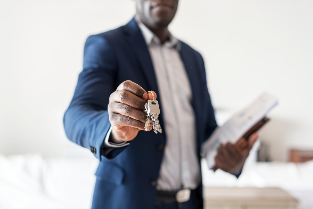 man handling a key