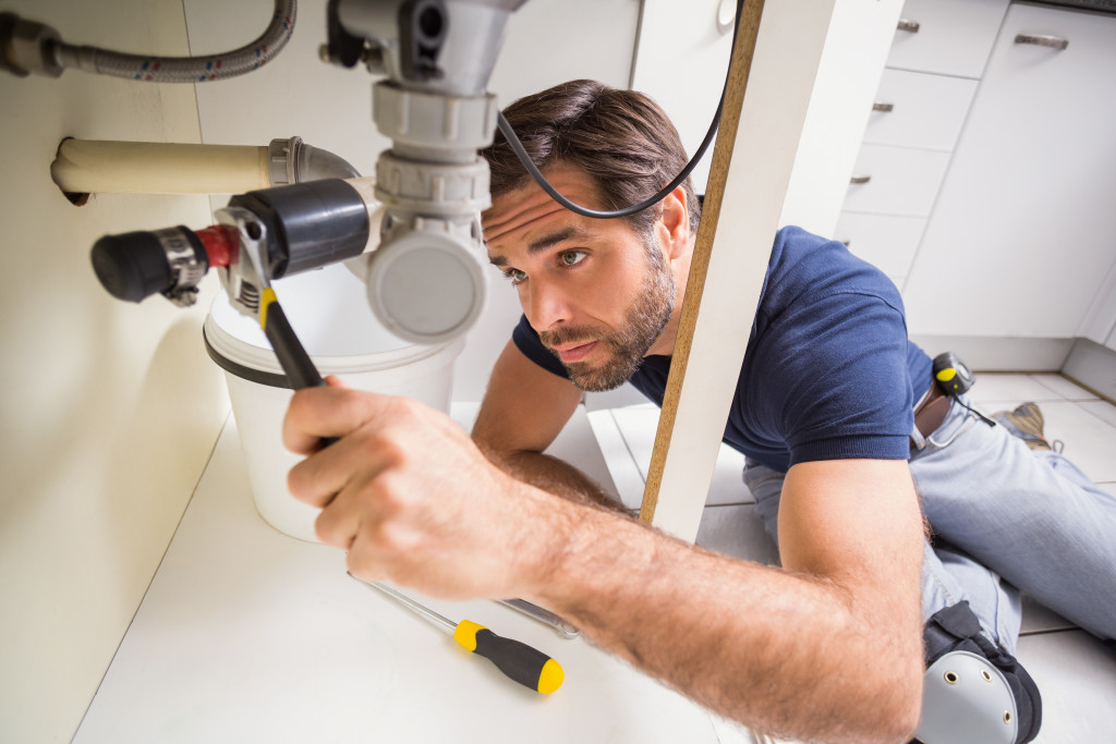 plumber under sink