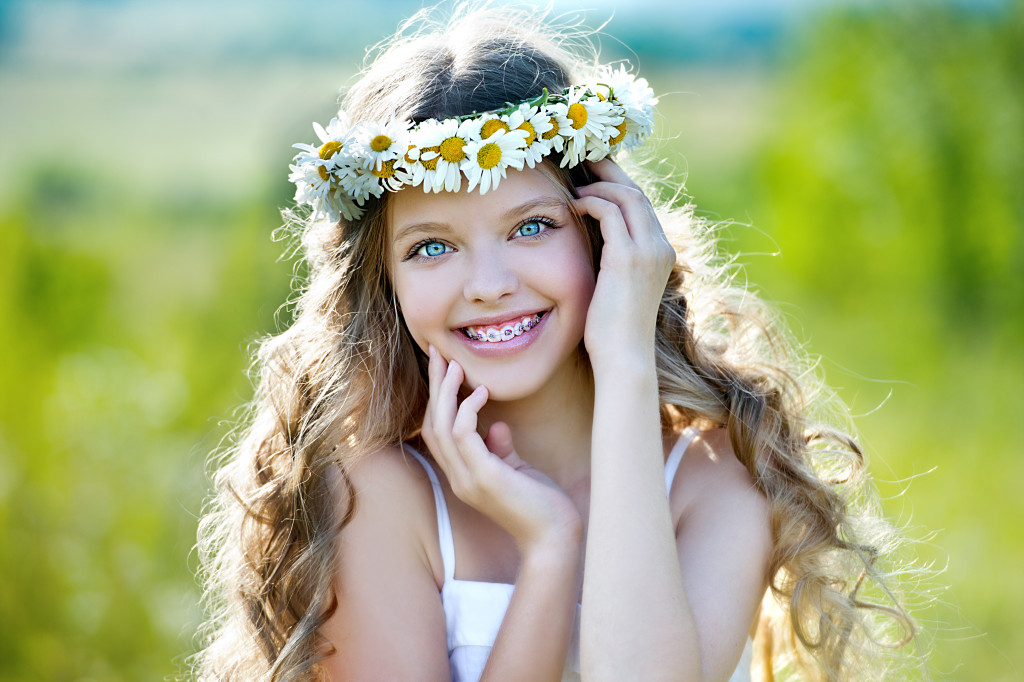 Healthy, beautiful smile, the child to the dentist.Portrait of a little girl with orthodontic appliance .