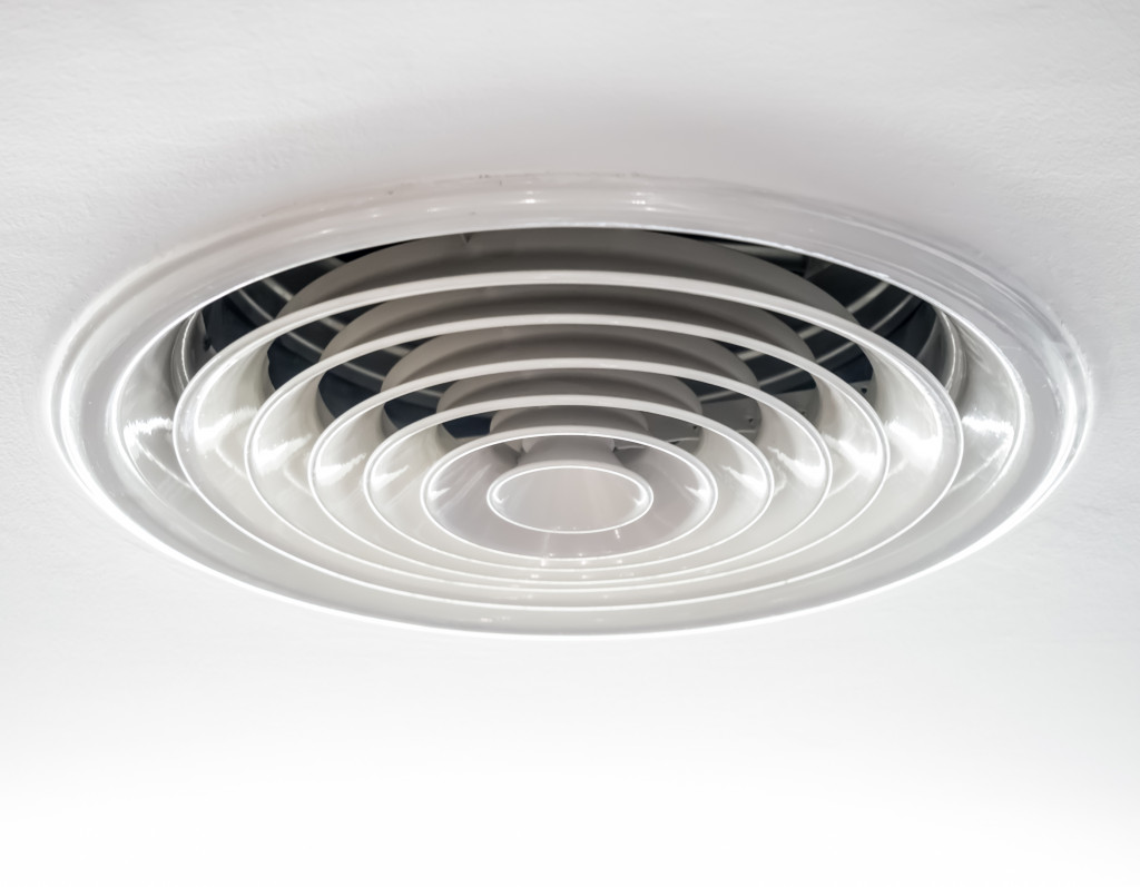 Circular air ventilation duct on the ceiling in white