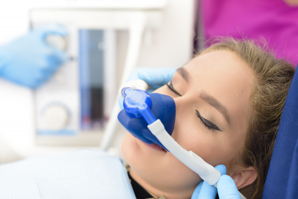 A woman getting sedated prior dental surgery