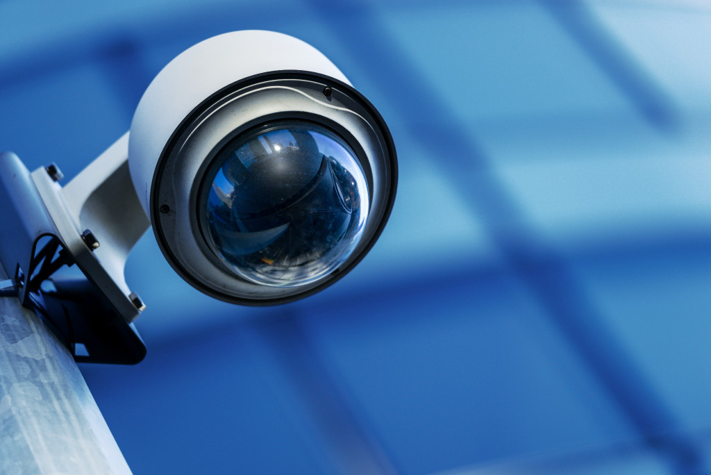 A security camera with a blue background