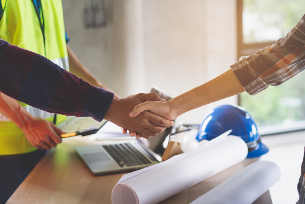 business owner handshake with supplier