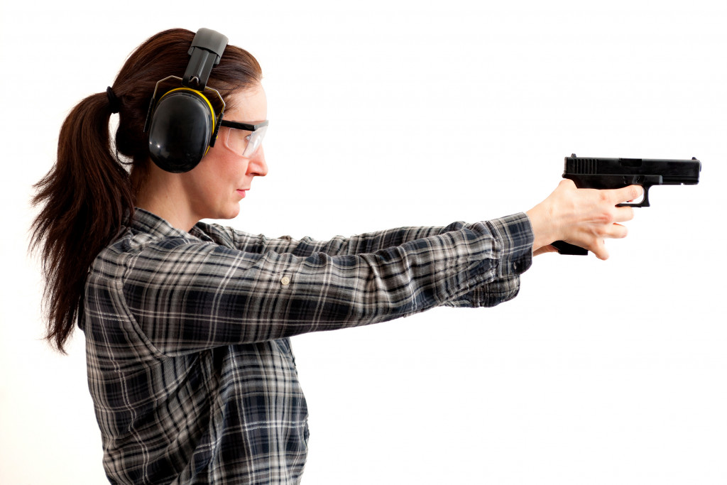 A gun store staff training weapon handling