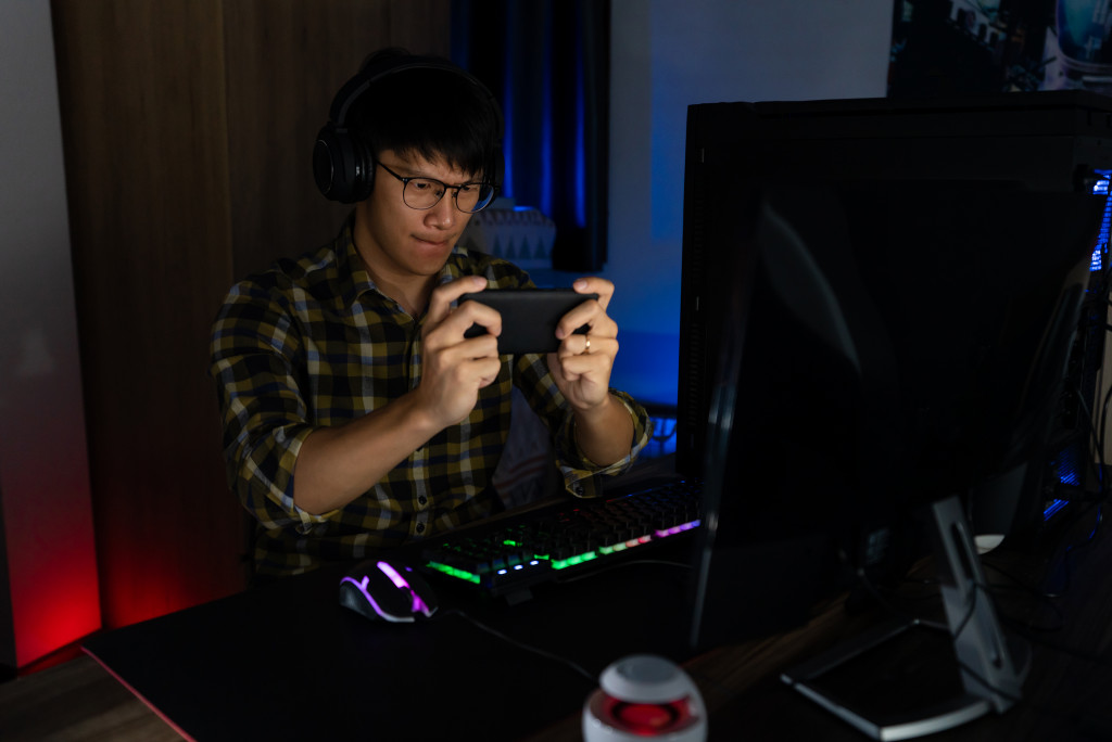 young asian teen playing video games