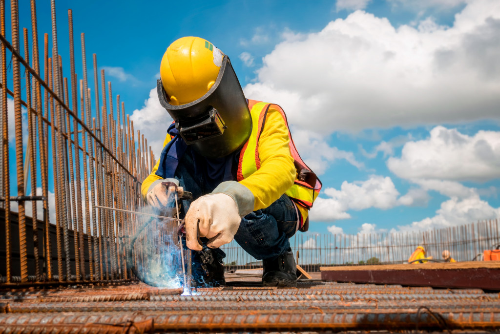 construction worker welding in a site