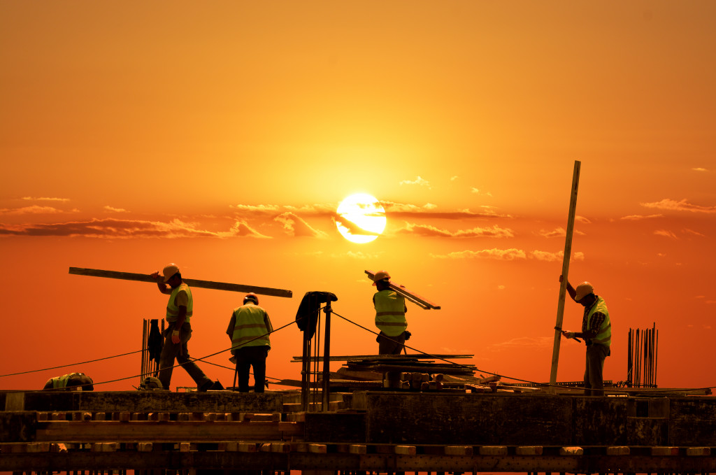 construction company workers in the sunset