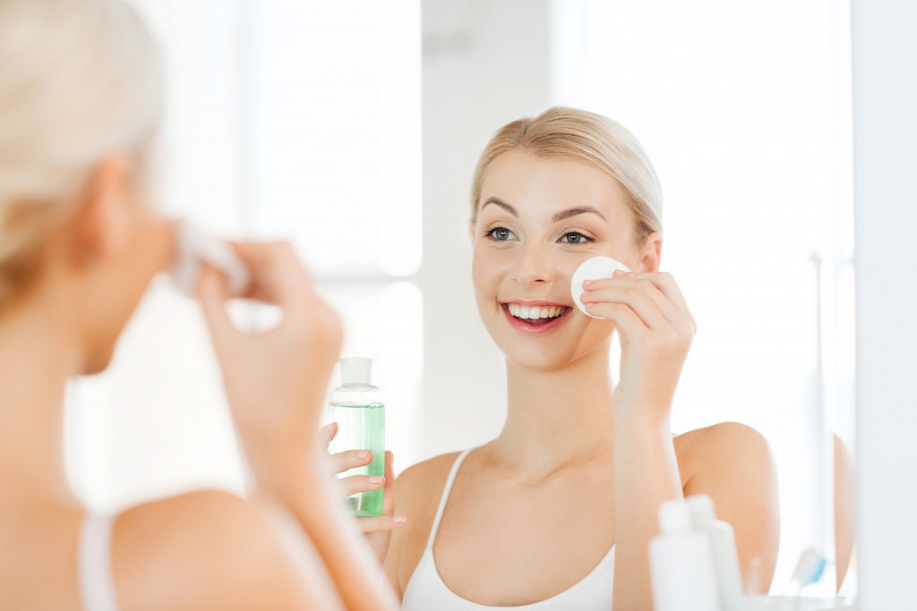 A woman using a cleanser